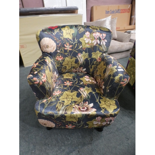 3153 - A floral tub-style armchair * this lot is subject to VAT