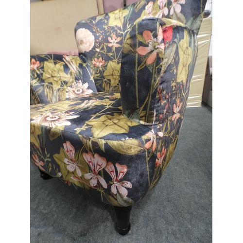 3153 - A floral tub-style armchair * this lot is subject to VAT