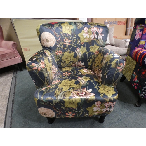 3153 - A floral tub-style armchair * this lot is subject to VAT