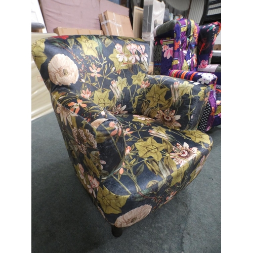 3153 - A floral tub-style armchair * this lot is subject to VAT