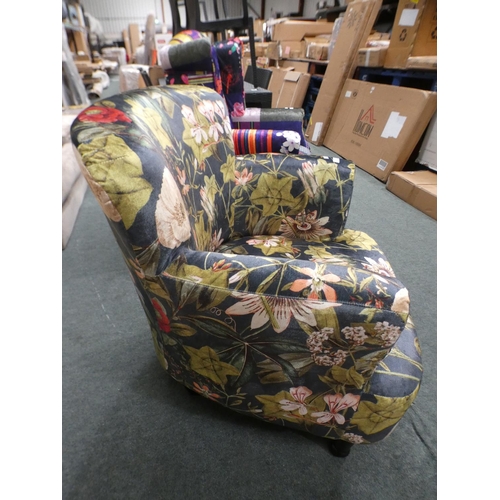 3153 - A floral tub-style armchair * this lot is subject to VAT