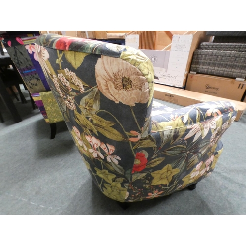 3153 - A floral tub-style armchair * this lot is subject to VAT