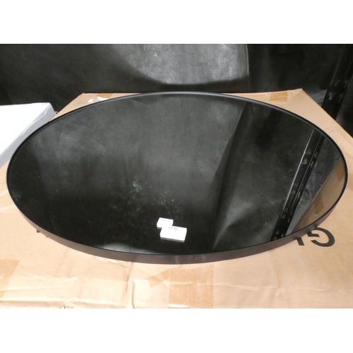 3170 - A circular black framed wall mirror * this lot is subject to VAT