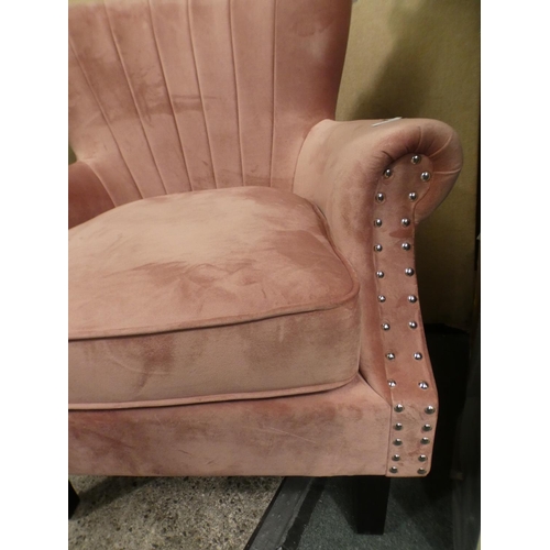 3228 - A blush pink velvet studded armchair * this lot is subject to VAT