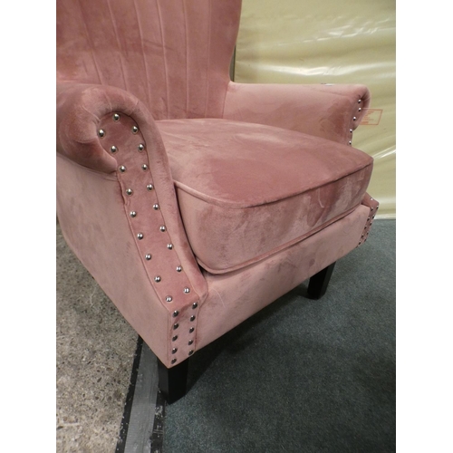 3228 - A blush pink velvet studded armchair * this lot is subject to VAT