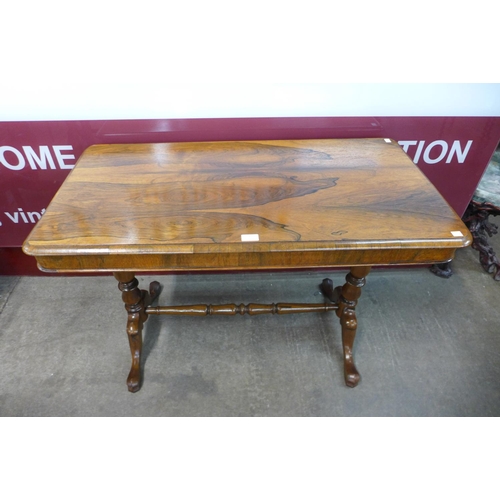 1 - A Victorian rosewood stretcher table