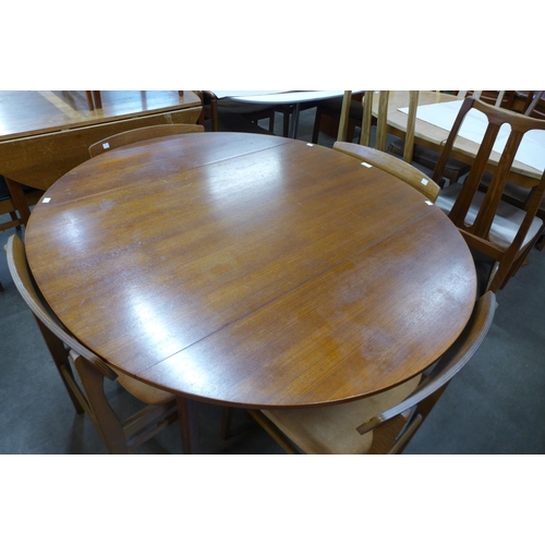 107 - A teak drop-leaf table and four chairs