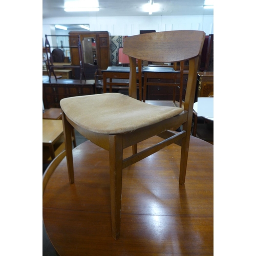 107 - A teak drop-leaf table and four chairs