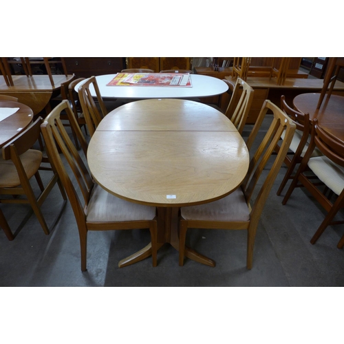 108 - A Nathan teak extending dining table and four chairs