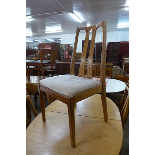 108 - A Nathan teak extending dining table and four chairs