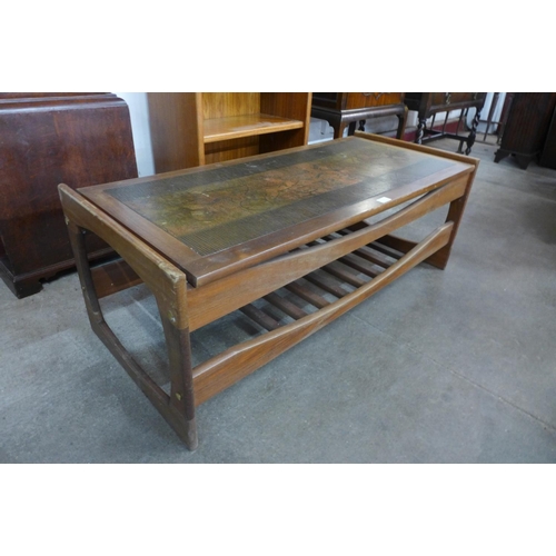 113c - A teak and copper topped Egyptian Revival coffee table