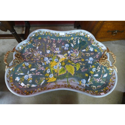 12 - A French style porcelain and ormolu mounted serving tray, decorated with exotic birds amongst flower... 