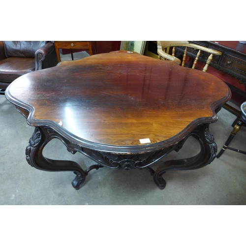 14 - A Victorian rosewood serpentine centre table