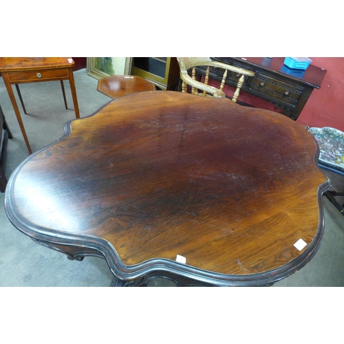 14 - A Victorian rosewood serpentine centre table