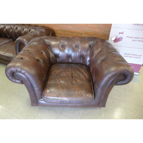 16a - A chestnut brown leather Chesterfield settee and matching armchair