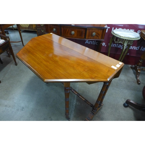 20 - A Victorian walnut Sutherland table