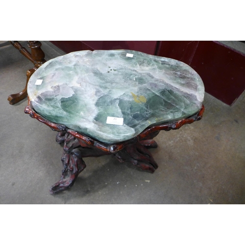 21 - A Chinese green hardstone occasional table, on naturalistic root wood stand