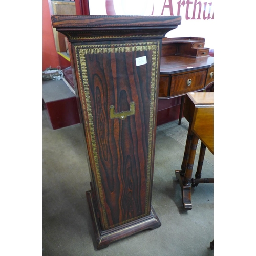 23 - A French style simulated rosewood leather and parcel gilt eight drawer chest