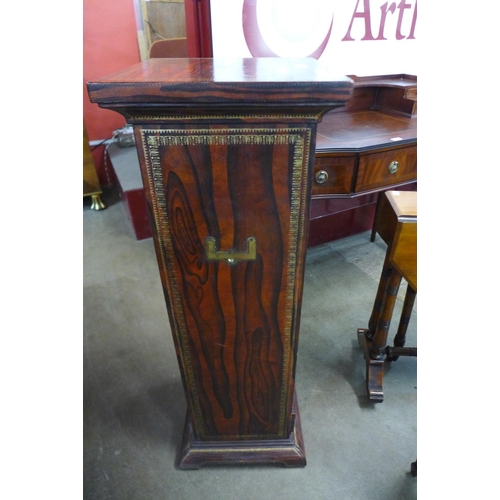 23 - A French style simulated rosewood leather and parcel gilt eight drawer chest