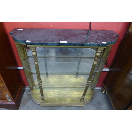 25 - A French Louis XV style gilt wood and marble topped breakfront display cabinet