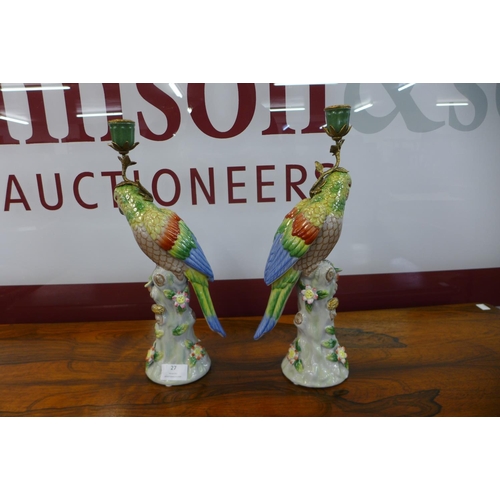 27 - A pair of French style porcelain figural parrot candlesticks