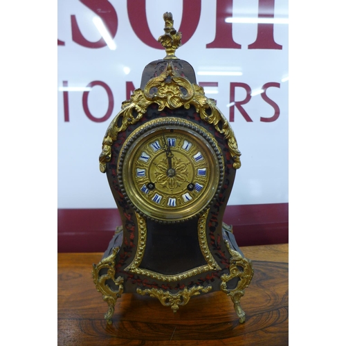 28 - A 19th Century French Boulle style mantel timepiece, stamped Marti & Cie. (lacking pendulum)