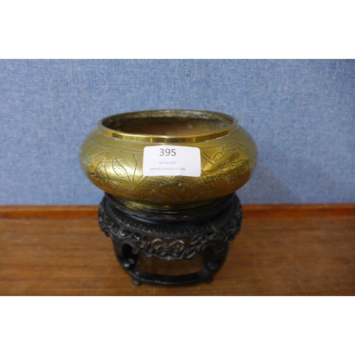 395 - A small Chinese brass censer, on carved wood stand