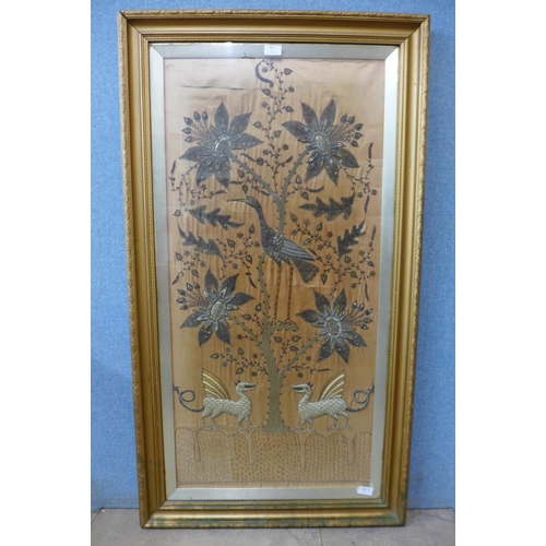 403 - A late 19th Century large silk and silver embroidered needlework panel depicting a crane in a tree w... 