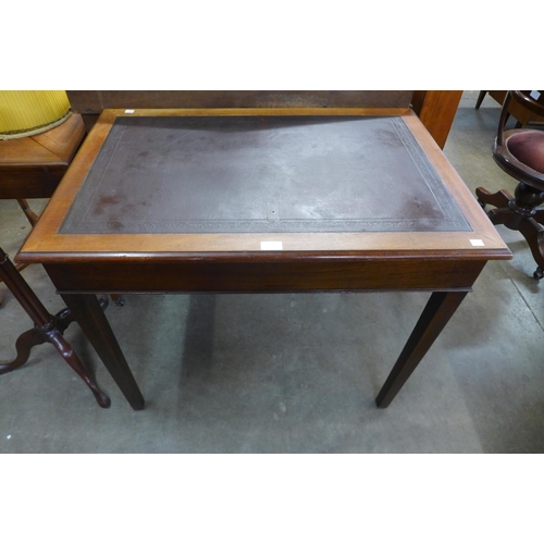 41 - An Edward VII mahognay and leather topped writing table