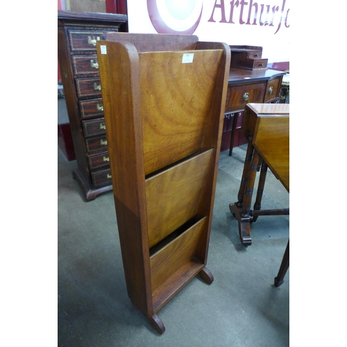 45 - An Art Deco walnut newspaper stand