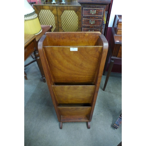 45 - An Art Deco walnut newspaper stand