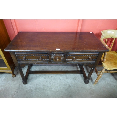 5 - A 17th Century style oak three drawer dresser