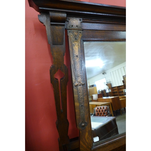 8 - An Arts and Crafts oak and copper mounted dressing chest, manner of Liberty & Co.