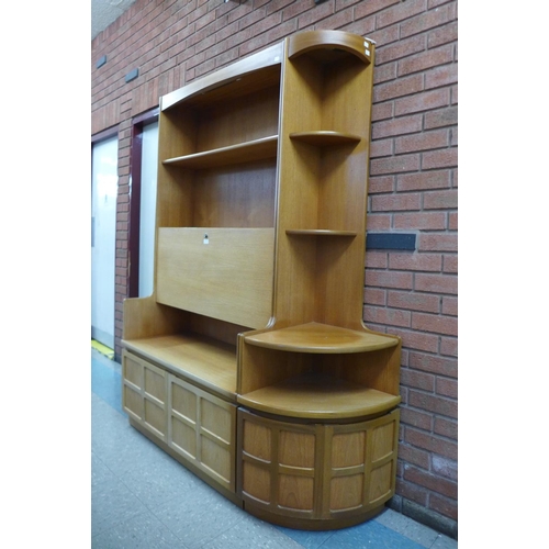 83 - A Nathan teak room divider and a matching corner cabinet