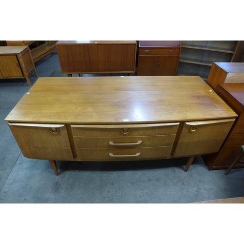 90 - A Beautility teak bow front sideboard