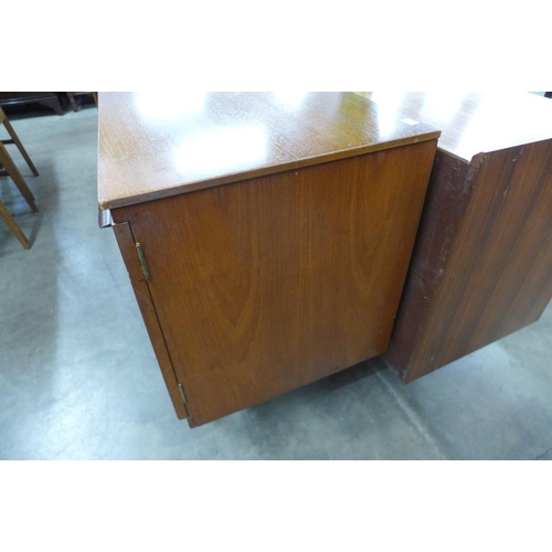 94 - A teak concave sideboard