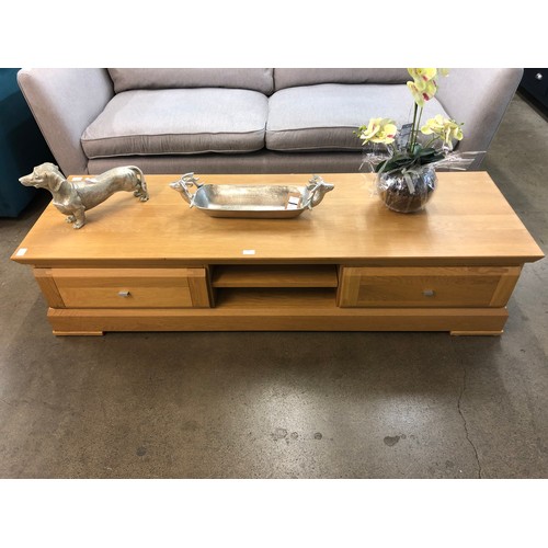 1308 - A large oak two drawer TV cabinet