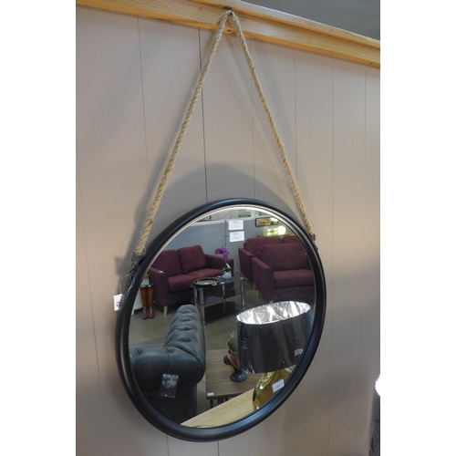 1327 - A circular black framed mirror with rope hanger, 58cms, (JRG1714)   #