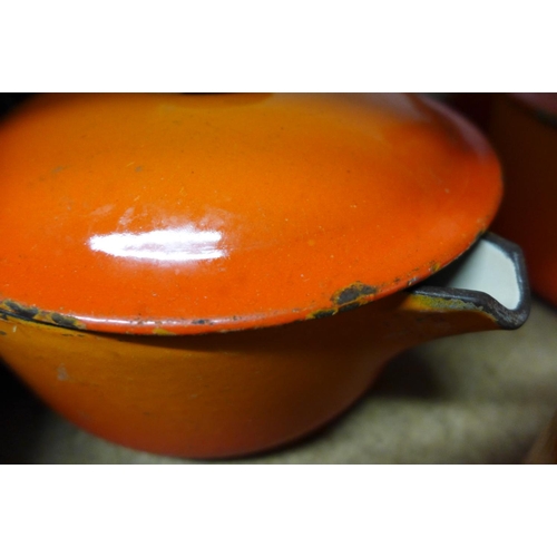 2151 - 4 Le Creuset pans in orange fade & Lina cast iron pan - unmatching