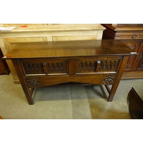 12 - A 17th Century style carved oak two drawer dresser