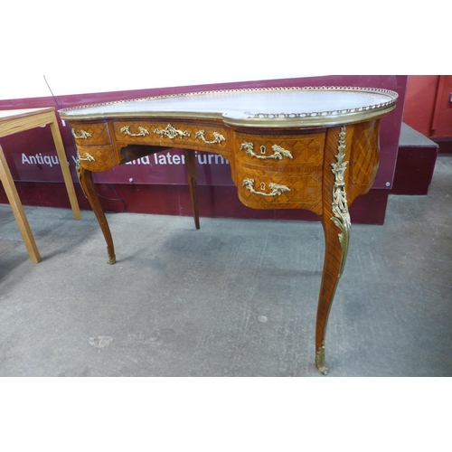 30 - A French Louis XV style parquetry inlaid kingwood and ormolu mounted kidney shaped writing table