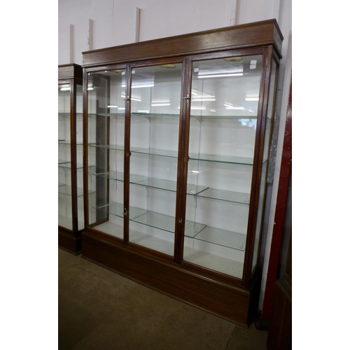 122 - A large mahogany three door shop display cabinet, 215cms h, 185cms w, 38cms d