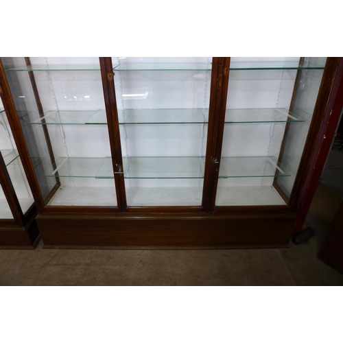 122 - A large mahogany three door shop display cabinet, 215cms h, 185cms w, 38cms d