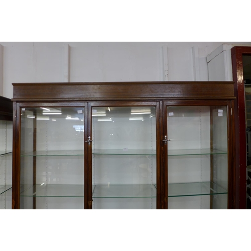 122 - A large mahogany three door shop display cabinet, 215cms h, 185cms w, 38cms d