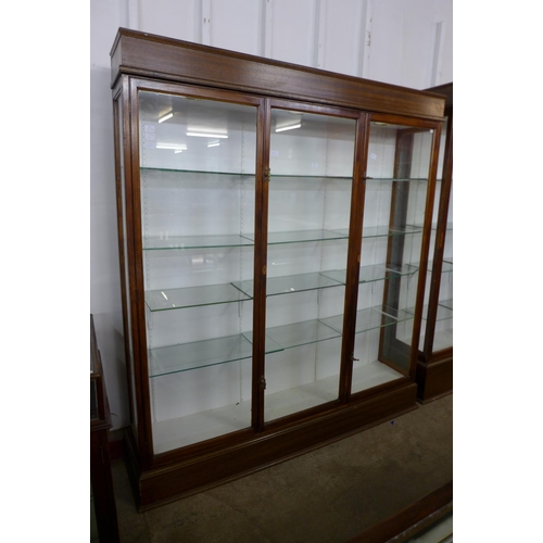 123 - A large mahogany three door shop display cabinet, made by F. Maund & E. Berg Ltd., Showcases & Shopf... 