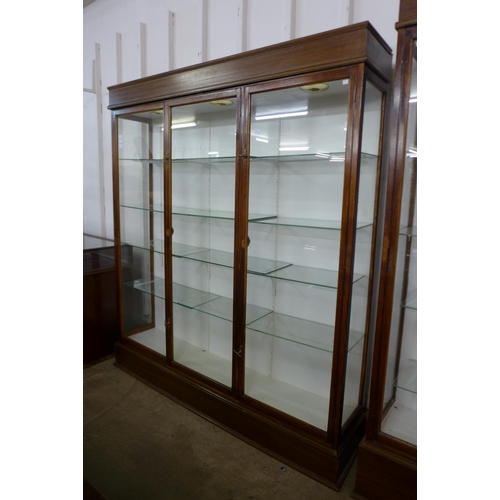 123 - A large mahogany three door shop display cabinet, made by F. Maund & E. Berg Ltd., Showcases & Shopf... 