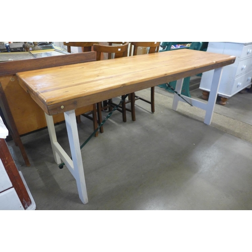 209 - A painted pine trestle table