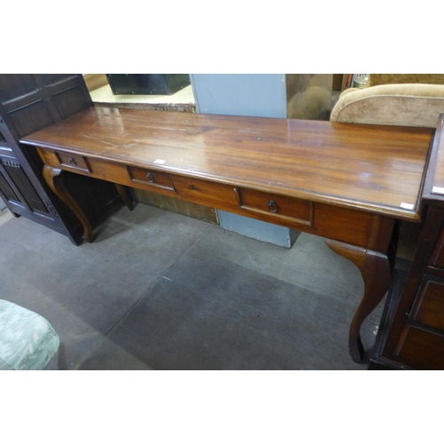 211 - A hardwood three drawer serving table