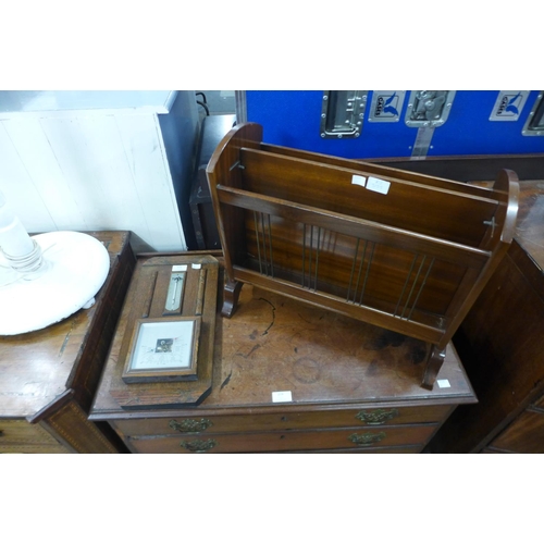 232 - An oak aneroid barometer and a mahogany magazine rack