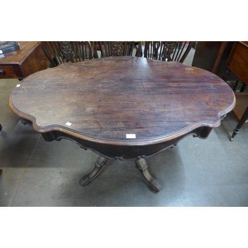 136 - A 19th Century French rosewood two drawer serpentine centre table